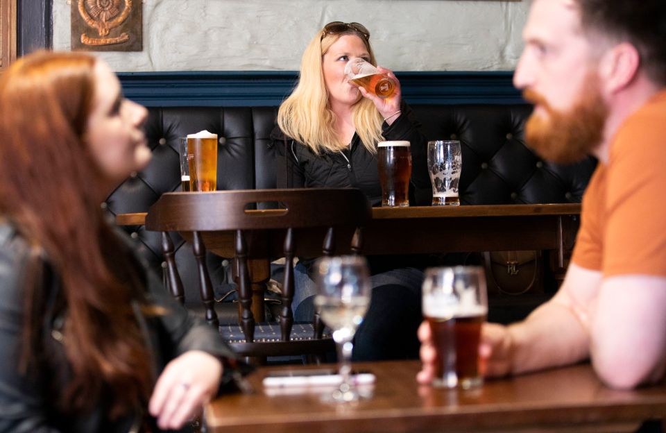 Drinkers enjoy pints in Edinburgh after most of the country eased into Level 2 yesterday