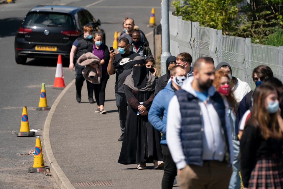 Brits queue to get vaccinated in Bolton as the jab rollout continues