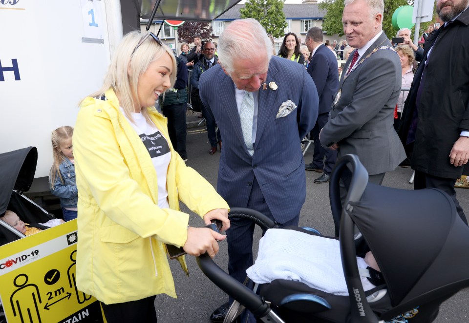 Dressed in a blue suit, he beamed as he greeted members of the public