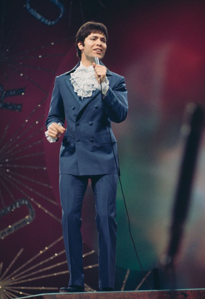 Cliff Richard seemingly inspired Austin Powers with his ruffled shirt and blue suit