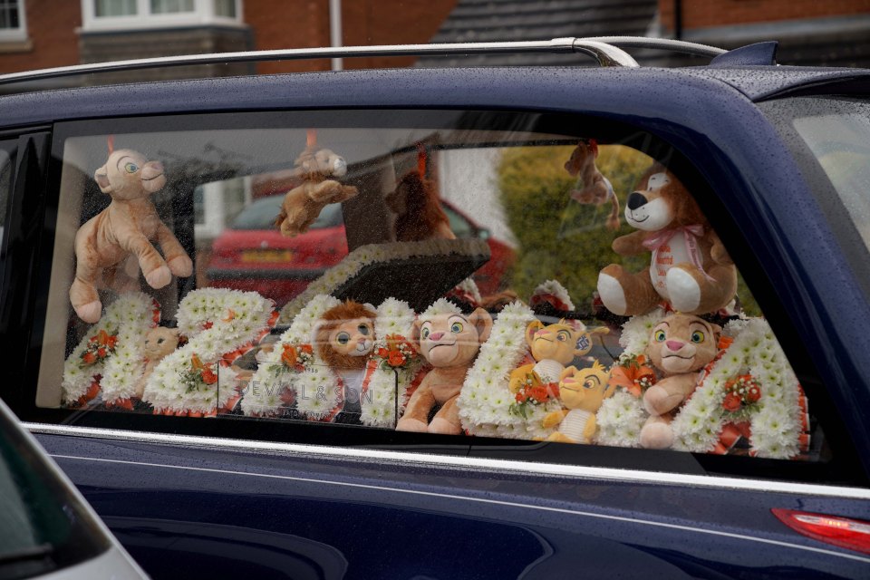 Her name was spelt out in flowers and surrounded by teddies