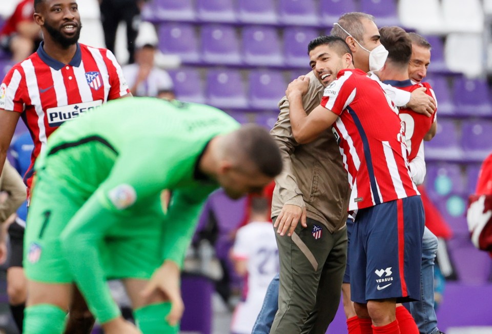 An emotional Suarez celebrates with his team-mates after clinching the title