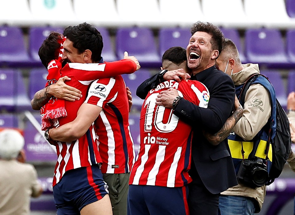 Atletico boss Diego Simeone celebrates winning his second LaLiga title with his players