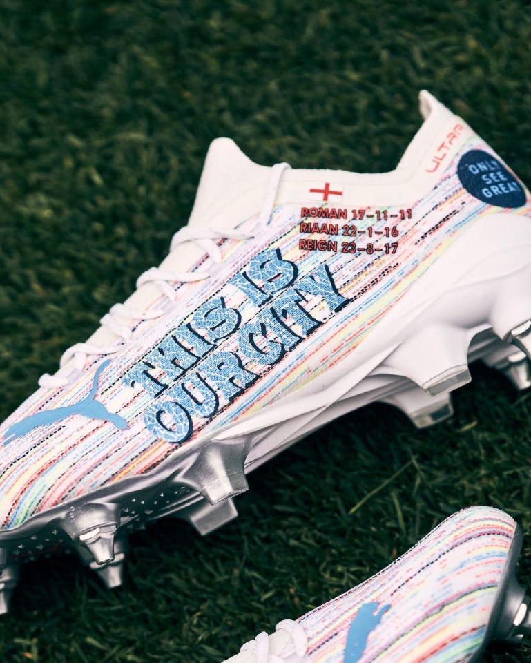 He proudly showed off football boots complete with three of his four children's names