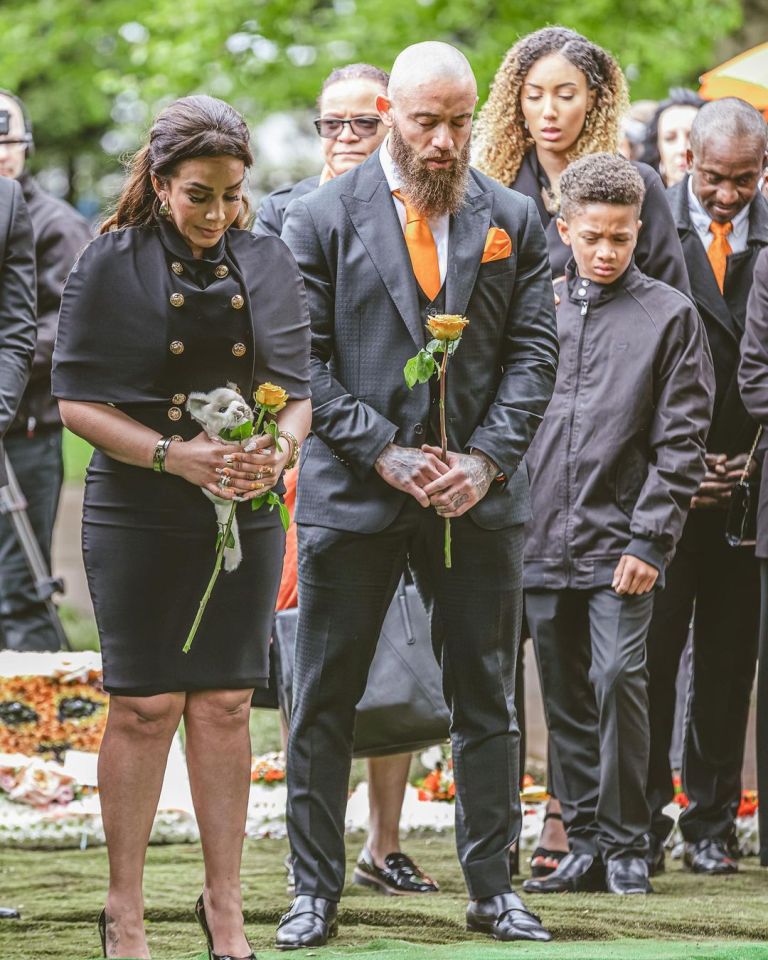 The couple bid farewell to their daughter surrounded by loved ones