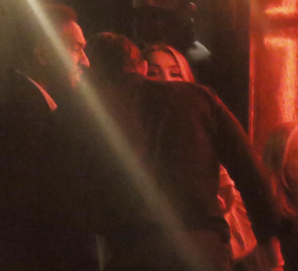 He whispered in her ear before they left the venue together