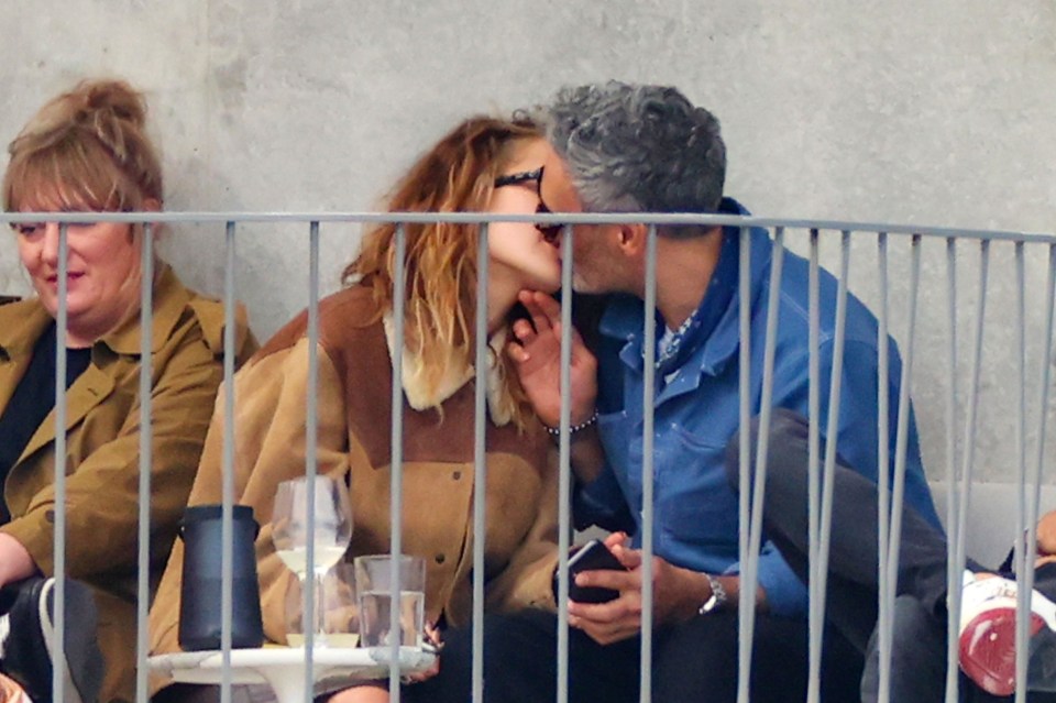 Rita snogged Taika on the balcony of his home