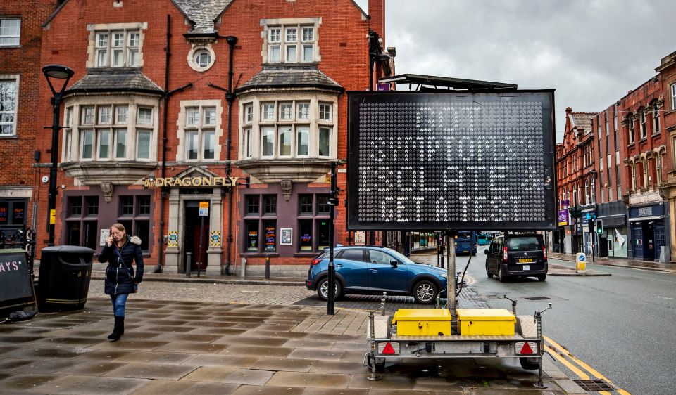 An electronic notice board in Bolton town centre, one of the areas of the UK where the Covid variant first identified in India is spreading fastest