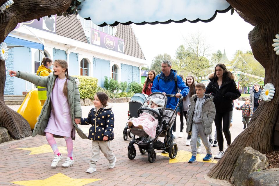 Noel was spotted pushing the younger kids in a pushchair as they explored the park