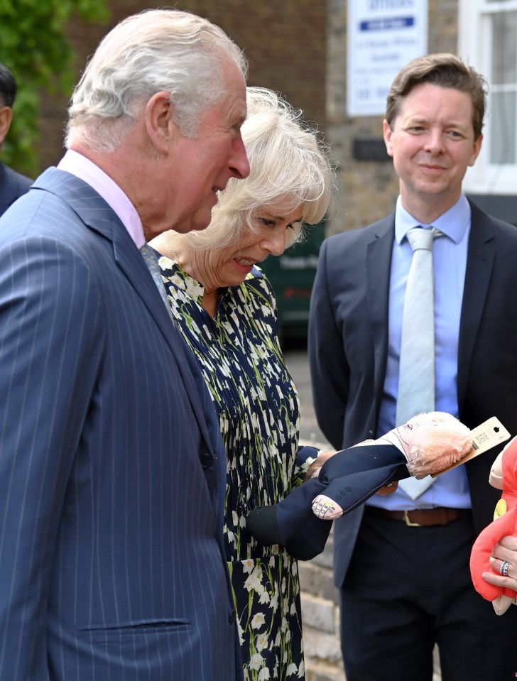 Camilla pulled a face as she held a squeaky dog chew