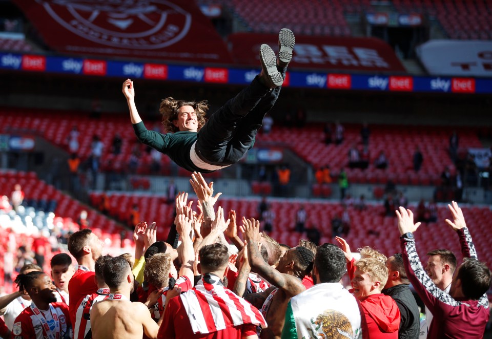 Brentford's stars toss manager Thomas Frank into the air to celebrate