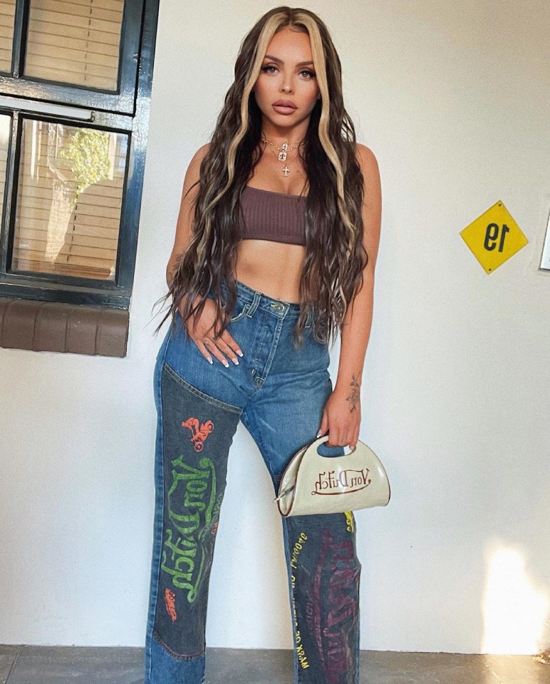 Jesy Nelson showed off her rock hard abs and tousled hair in a sizzling snap