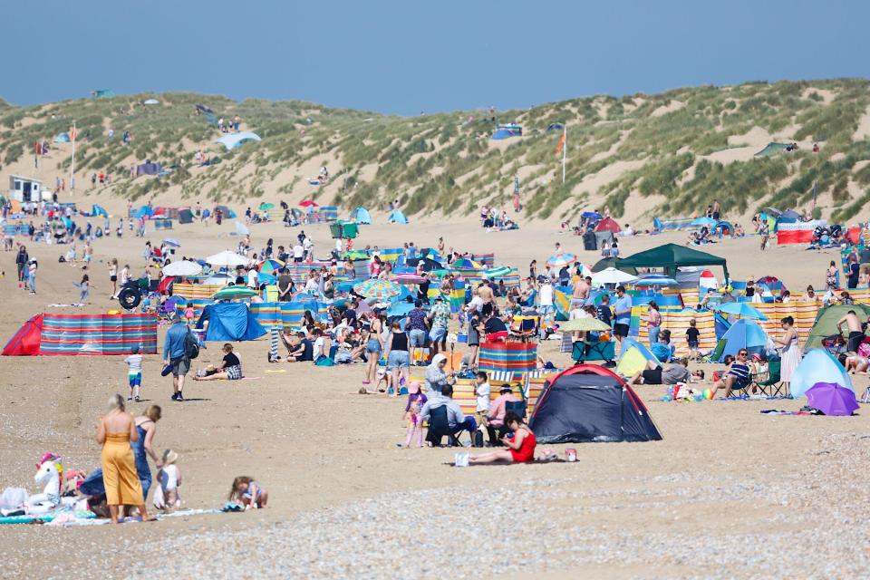 The beach in East Sussex was heaving with sunbathers this morning