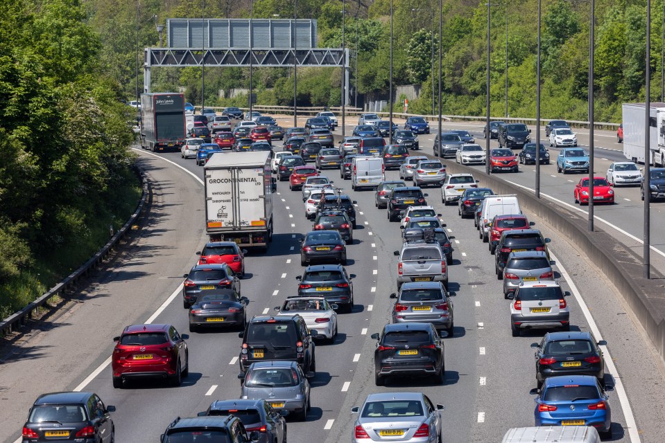 Heavy traffic builds up on the M25 near Leatherhead in Surrey during the heatwave