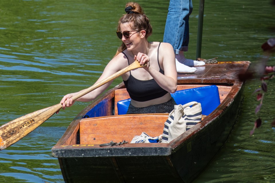 People go for a punt in the River Cam in Cambridge