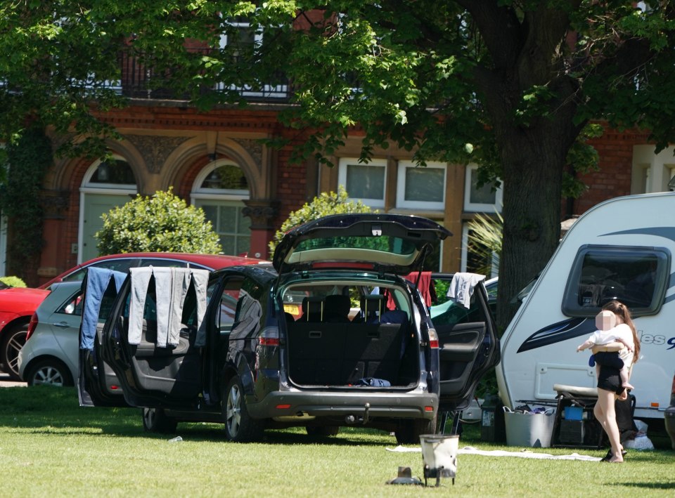 The group have set up camp in the affluent suburb, where homes sell for over £2 million, after arriving on Thursday evening with 12 caravans and other vehicles