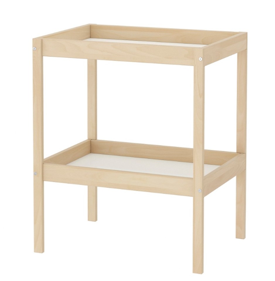 The changing table is available in a light timber