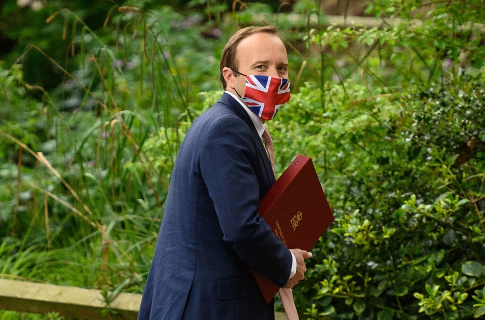 Health Secretary Matt Hancock wearing a Union Jack face mask earlier this week