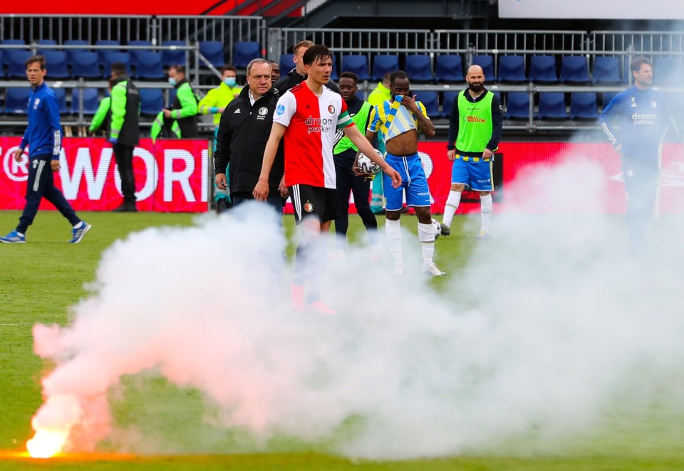 Ex-Sunderland boss Dick Advocaat watched on as flares hit the pitch