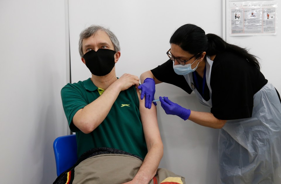 Prof Paul Hunter said people should not decline their offer of an AstraZeneca vaccine. Pictured: Fabian Cassar, 47, takes his shot on April 16