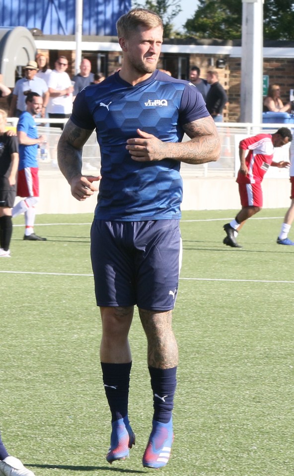 Dan showed off his muscular physique in the blue kit