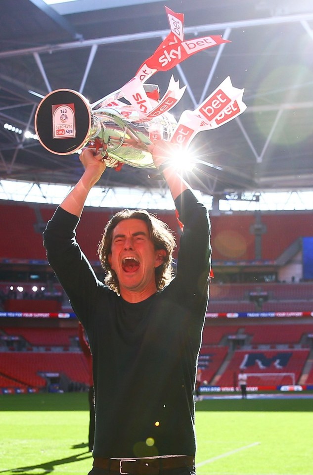 Thomas Frank lifts the Championship play-off trophy at Wembley