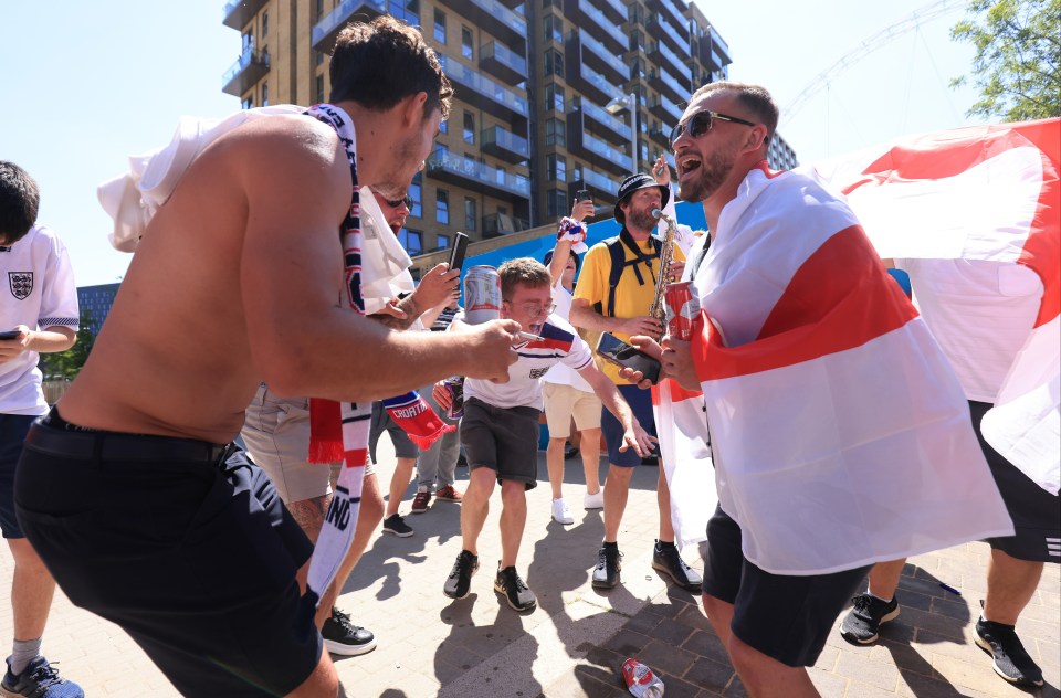 Lads with beers show their support for the first group game