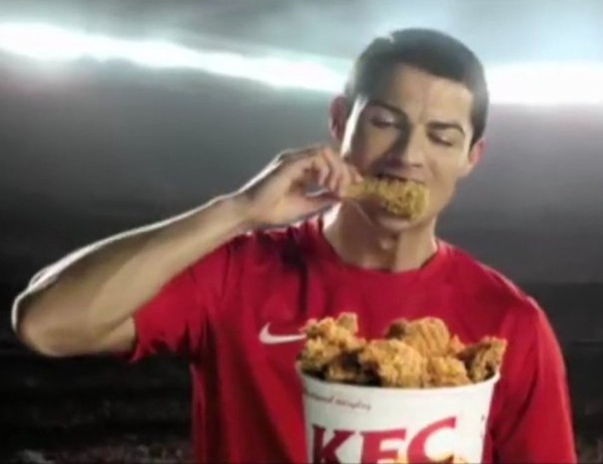 The footballer took a bite from KFC wings bucket before telling fans 'so good!'