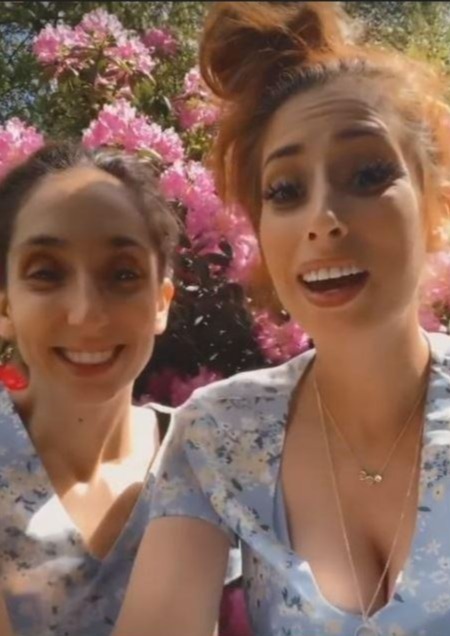 The pair later posed together in matching floral dresses