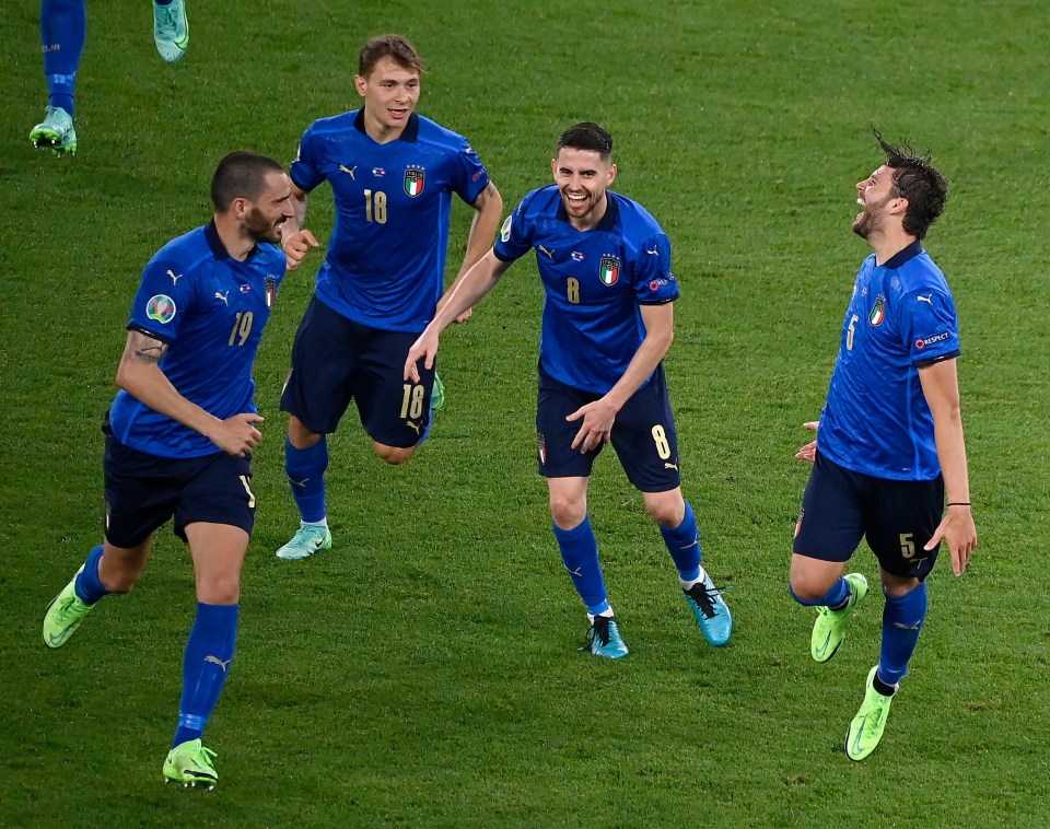 The Italians celebrate their second goal