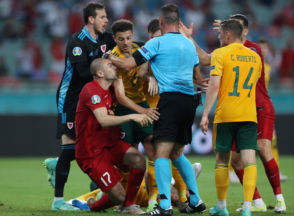 Turkey's Burak Yilmaz clashes with Ethan Ampadu in a heated climax