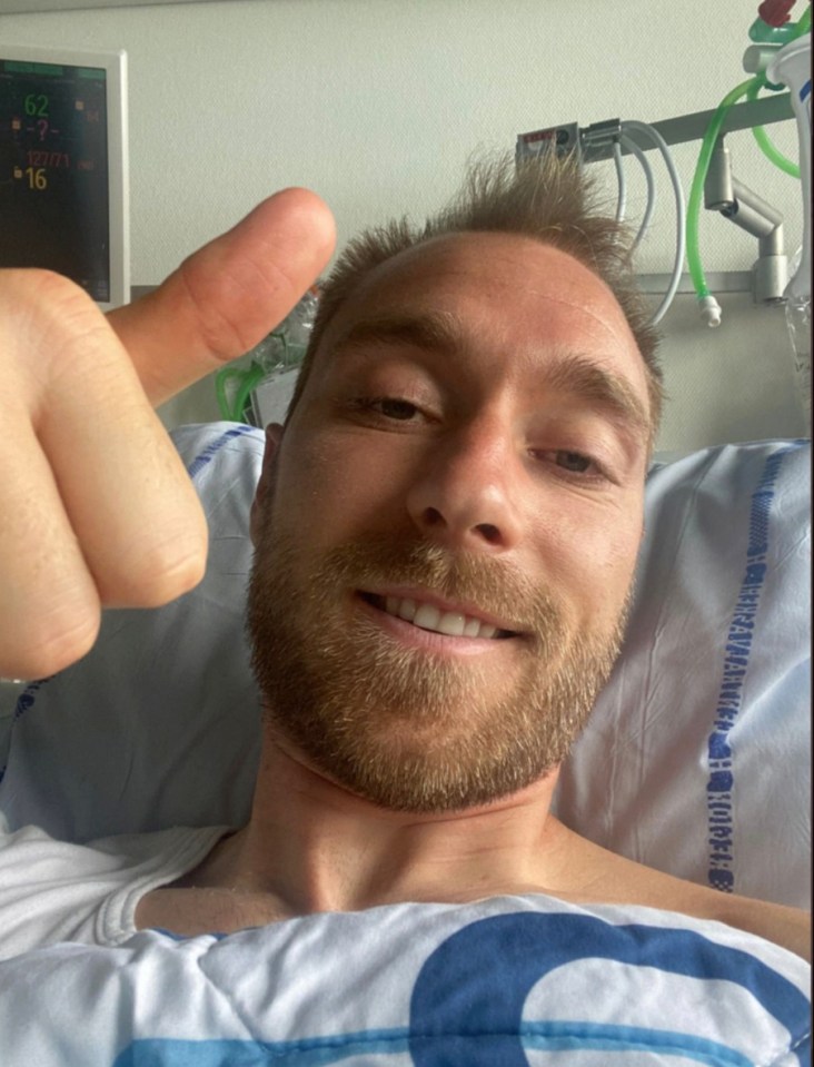 Eriksen gives a thumps up from his hospital bed