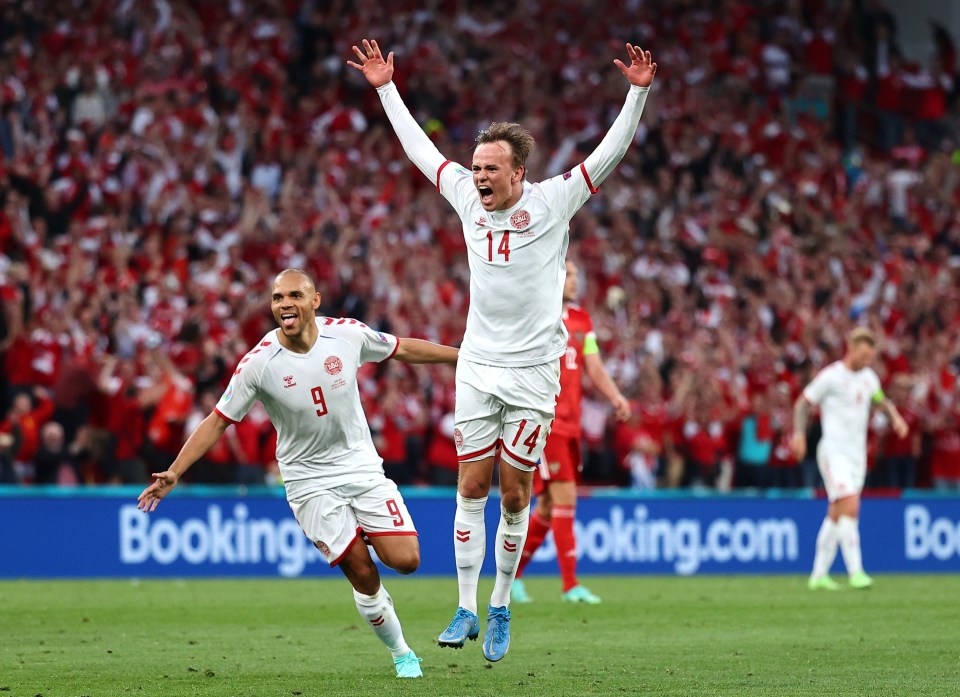 Denmark's Mikkel Damsgaard celebrates with team-mate Martin Braithwaite after his 38th minute opener