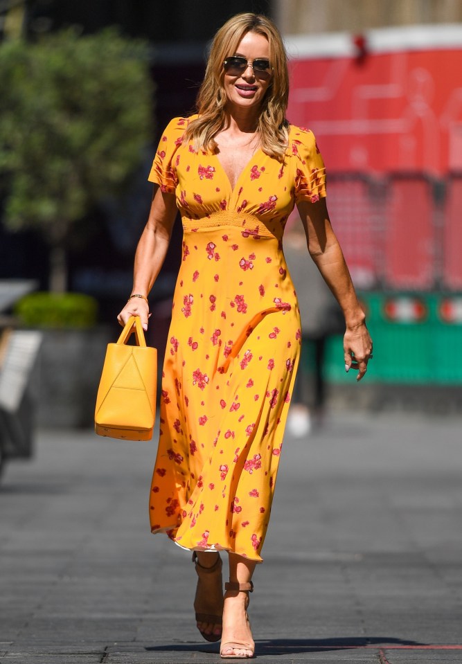 Amanda Holden soaked up the glorious sunshine in a floral midi dress