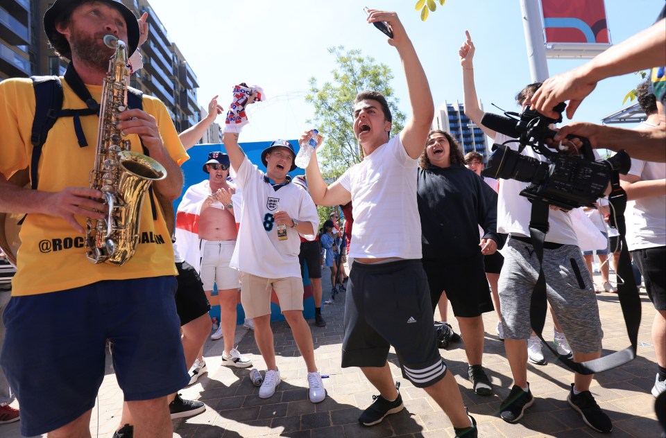 Fans sing and dance as the atmosphere swells at Wembley