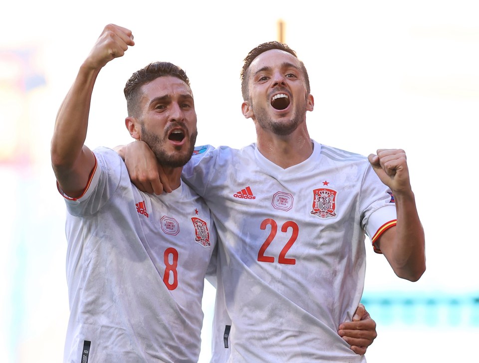 Pablo Sarabia celebrates with Koke after putting Spain 3-0 up