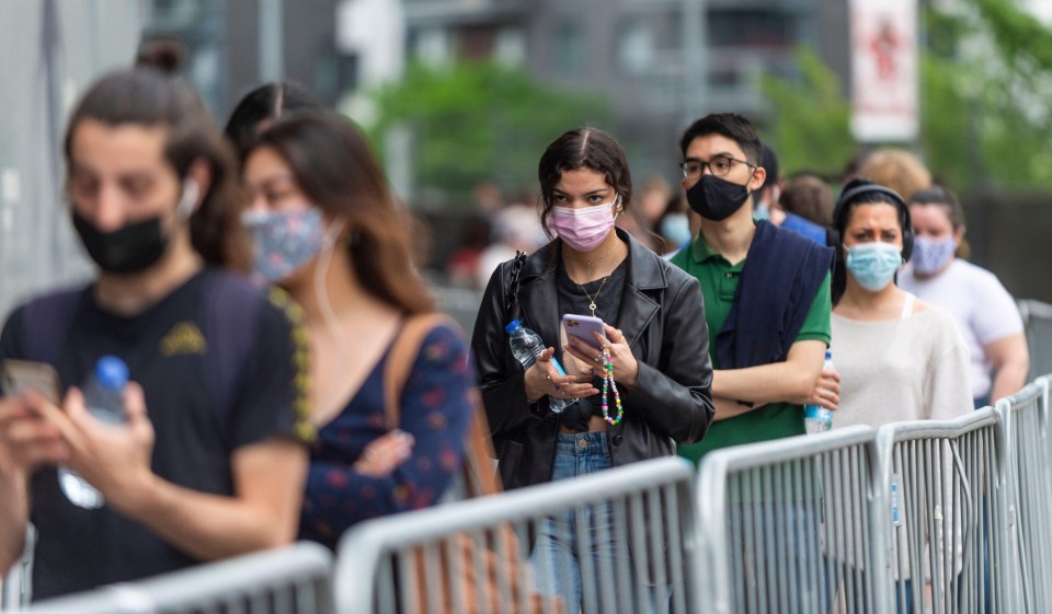 People queuing up to receive a first dose of the Pfizer vaccine outside Emirates Stadium