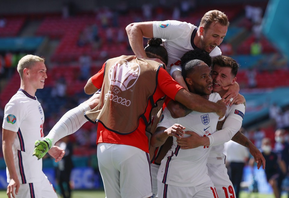 The Manchester City is mobbed after firing England ahead