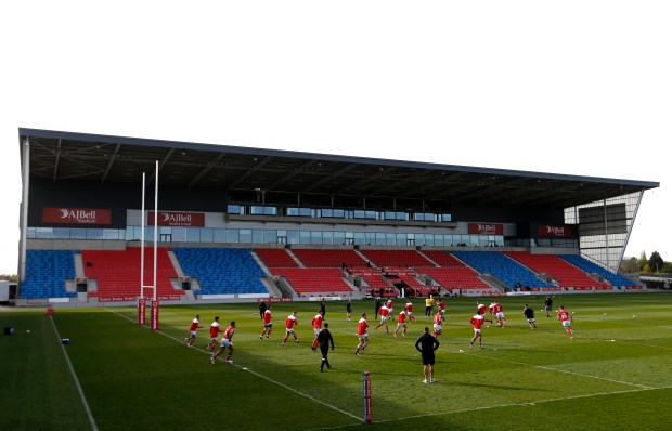 a stadium with a red and blue bleachers and a sign that says &quot; albell &quot;