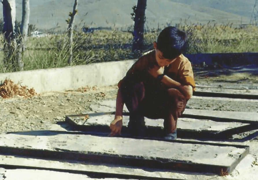 Farideh's son at his father's grave