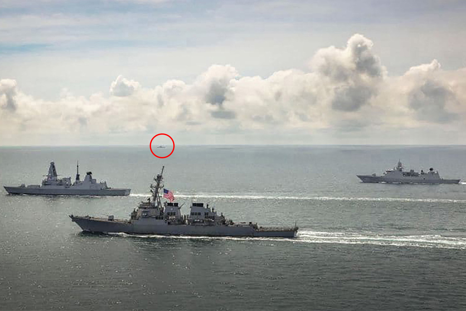 HMS Defender, HNLMS Evertsen and USS Laboon in operations in the Black Sea five days ago - with a Russian vessel visible on the horizon