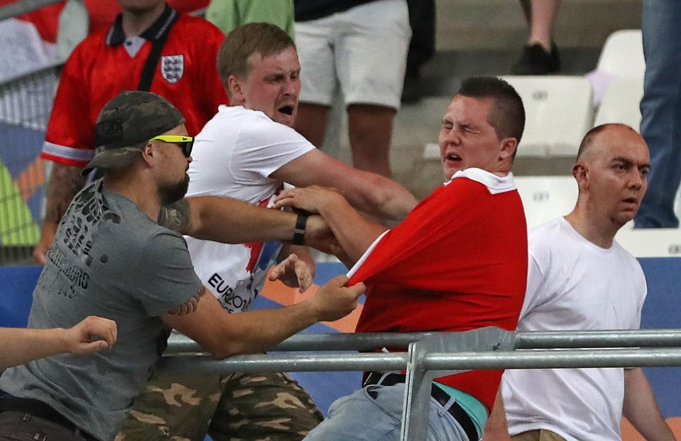 Russian supporters attack an England fan at the end of their Euro 2016 match in Marseille