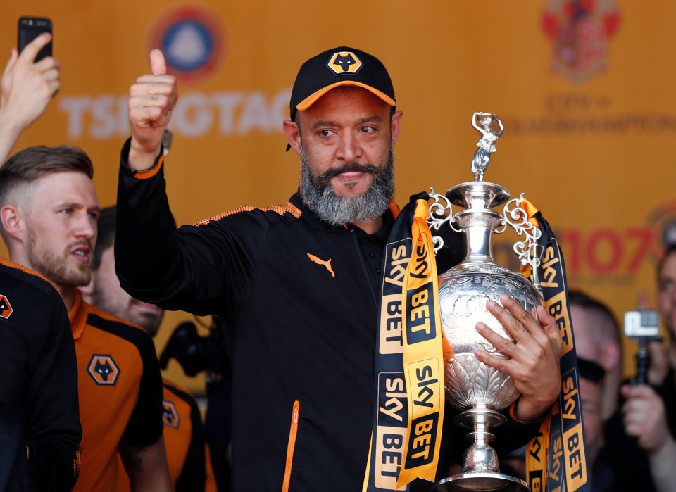 Nuno holds the Championship trophy after achieving promotion with Wolves