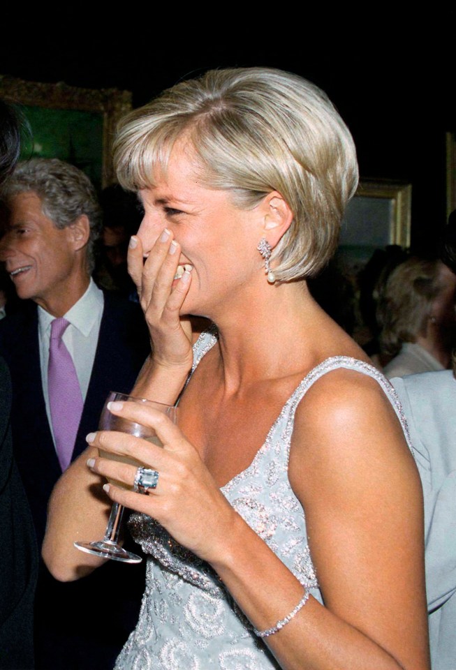 Diana looking delighted at a Christie's pre-auction party in 1997