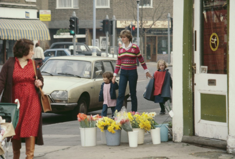 Diana holding hands with some of her pupils of the Young England kindergarten, Pimlico