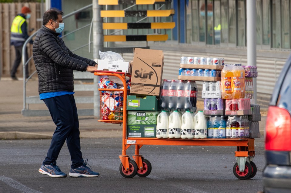 People stocking up at the Tesco cash and carry in Cambridge in January