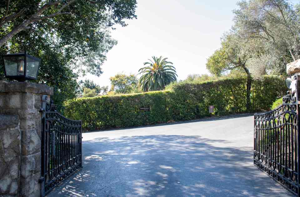 The entrance to the road leading to the royal couple's LA mansion