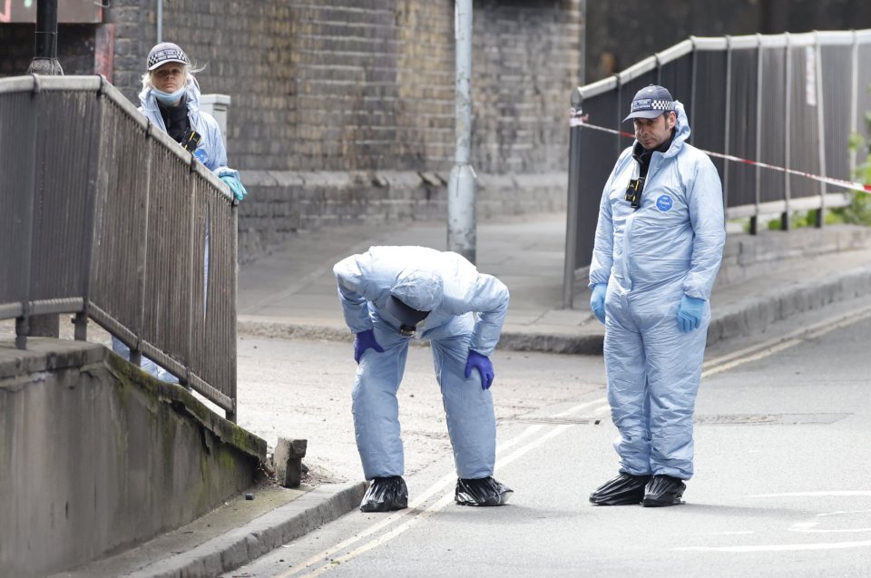 Forensics officers conduct a search at Consort Road in Peckham south London after Sasha Johnson was shot