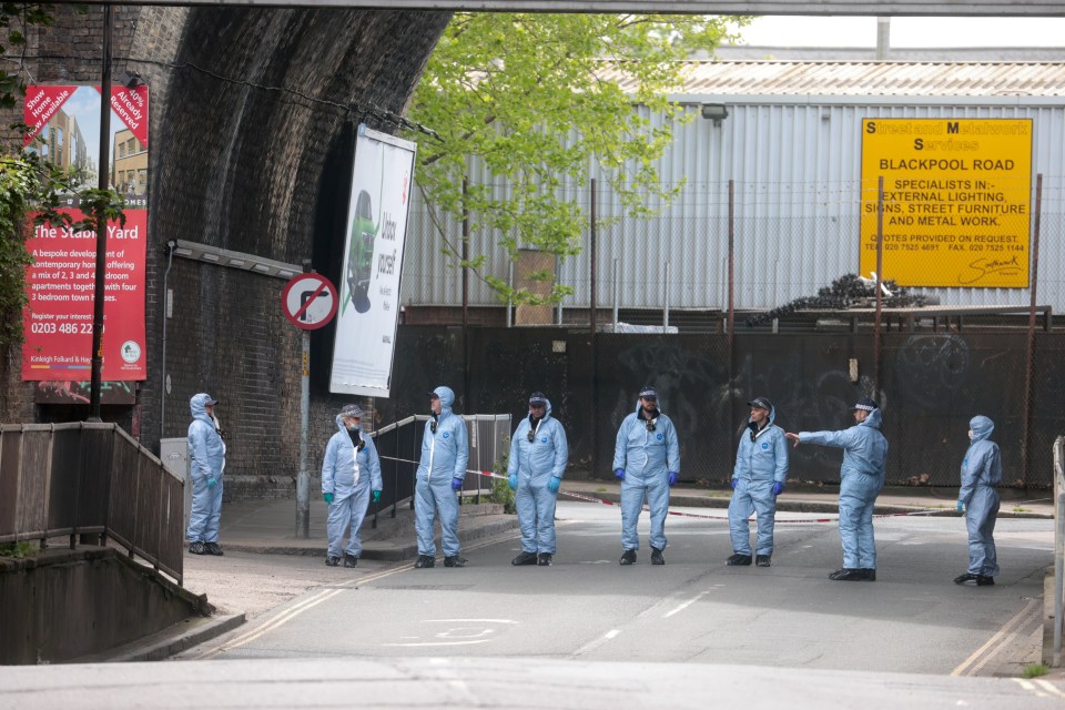 Forensic officers at the scene of the shooting