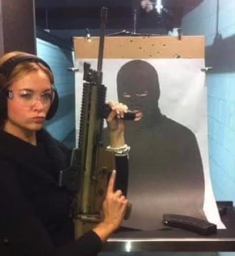 Hartin, pictured with a rifle, said she shot the cop by accident